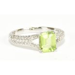 An 18ct white gold green peridot and diamond dress ring, size L, approx 2.8g.