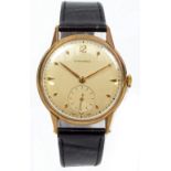LONGINES; a 9ct yellow gold cased gentleman's mechanical wristwatch, the circular dial set with