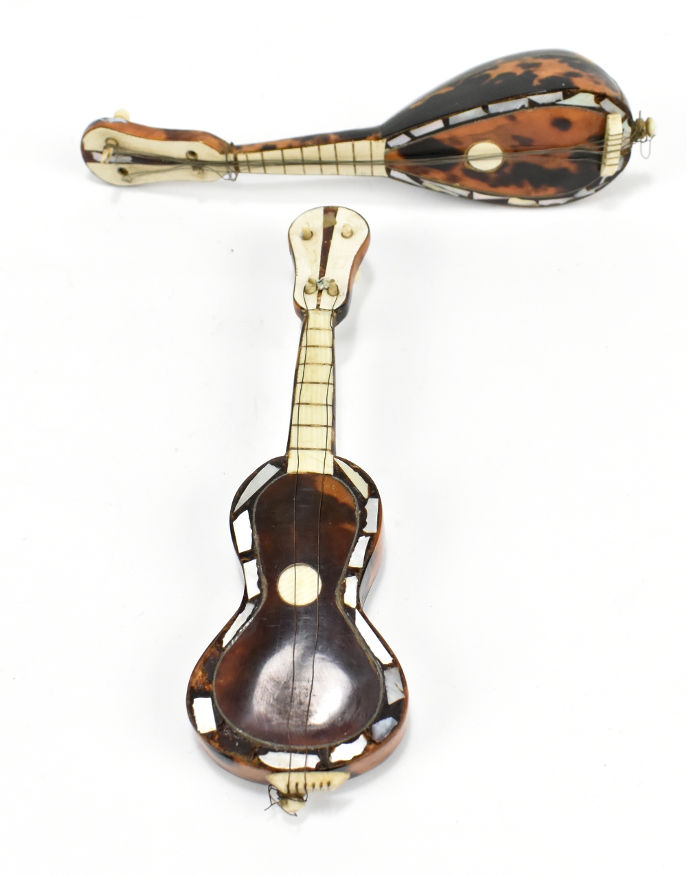 An Italian miniature tortoiseshell and mother of pearl mandolin, length 15cm, and a similar