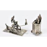 Two Dutch silver novelty miniatures comprising a seesaw and a gentleman upon a rostrum, possibly