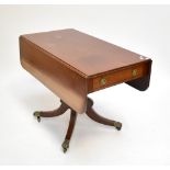 A 19th century mahogany Pembroke table with one real and one faux drawer on turned column to four