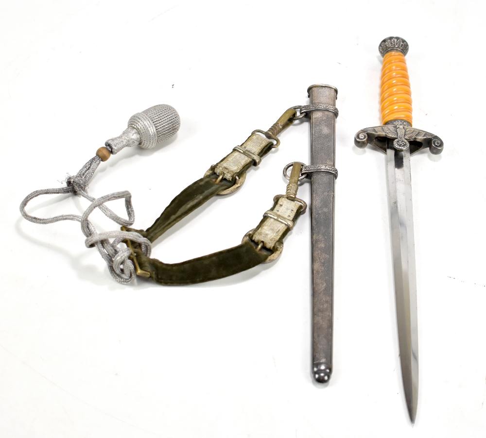 A Third Reich officer's Dienstdolch dagger, the unmarked blade length 26cm (bent), to orange grip