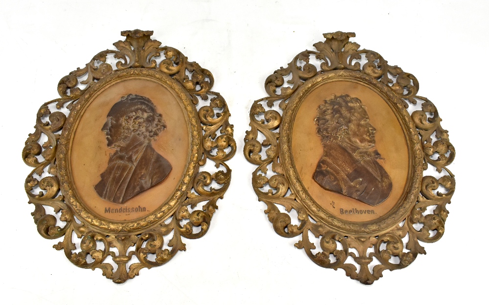 A large pair of late 19th century German cast iron foliate decorated pierced frames each centred