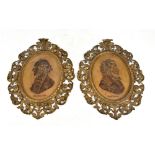A large pair of late 19th century German cast iron foliate decorated pierced frames each centred