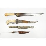 Four Indo-Persian Pesh-kabz daggers, two with ivory hilts, one with partial gilt floral decoration