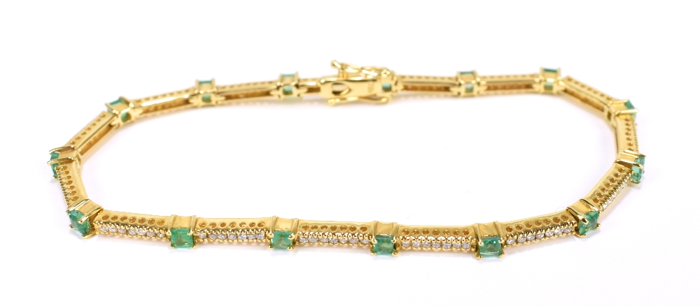 An 18ct yellow gold diamond and emerald bracelet set with fifteen emeralds totalling 1.5cts, and 105