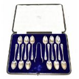 COOPER BROS & SONS LTD; a set of twelve George V hallmarked silver teaspoons and matching sugar