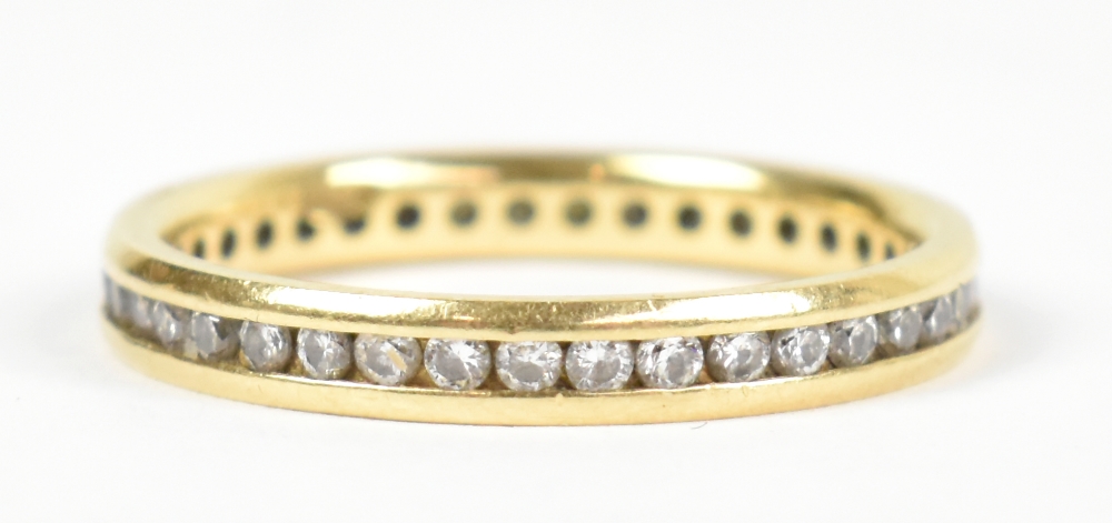 An 18ct yellow gold full eternity ring set with thirty-nine round brilliant cut stones, estimated