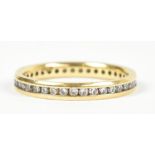 An 18ct yellow gold full eternity ring set with thirty-nine round brilliant cut stones, estimated