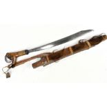 A Borneo Dyak tribe mandau or parang ilong headhunter sword with carved hilt, blade length 45.5cm,