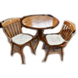 A pine circular table and four chairs (5).