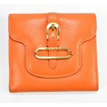 JIMMY CHOO; an orange leather purse with gold hardware, 10 x 9.5 x 2cm.