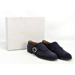 JIMMY CHOO; a pair of blue suede men's loafers with crossover silver-tone buckle, rubber sole and