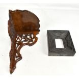 A deeply carved rectangular picture frame, 22 x 19cm, and a walnut corner wall bracket (2).