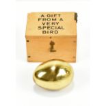 CARL AUBÖCK; an Austrian brass paperweight modelled as an egg, signed to base, length 5cm, in