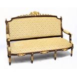 A reproduction French Louis XV style gilt wood and mahogany sofa, raised on fluted column