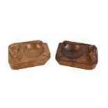 ROBERT 'MOUSEMAN' THOMPSON OF KILBURN; two adzed oak ashtrays with signature mice, the slightly