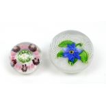 ST LOUIS; a glass paperweight, encased with floral motif on opaque chequered ground, diameter 5.5cm,
