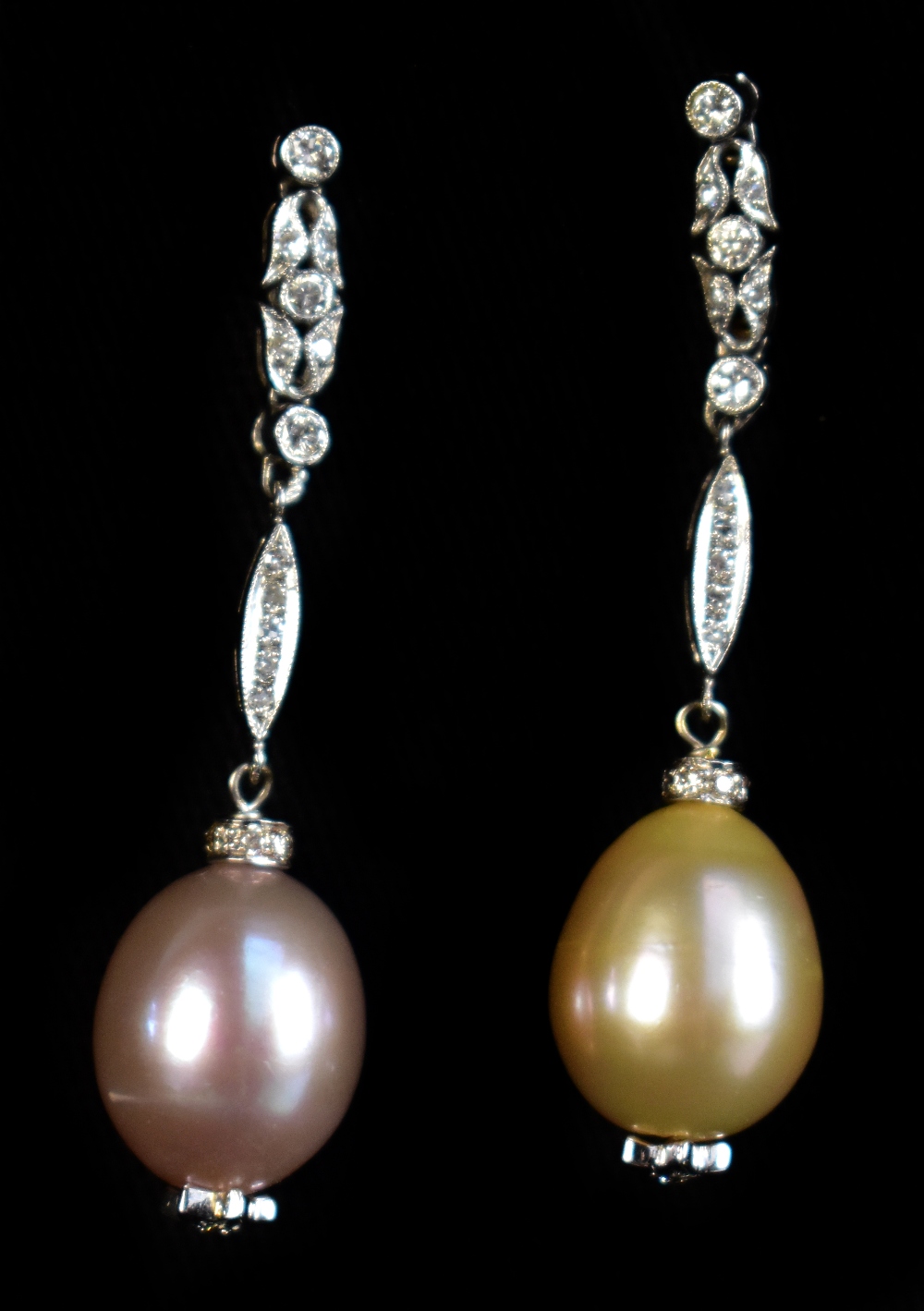 A pair of white metal, diamond and cultured freshwater pearl earrings, length of each 4cm,