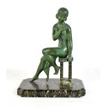 An Art Deco patinated bronze figure of a girl seated on a hardstone base, height 27cm.Additional