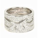 GEORG JENSEN; an 18ct white gold and diamond set three sectioned 'Fusion' ring, size P, approx