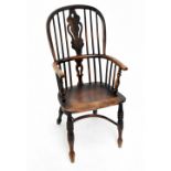 A 19th century ash and elm seated spindle back Windsor chair with pierced splat and crinoline