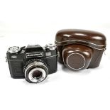 ZEISS; a Contaflex S with black body and Tessar 2,8/50 lens, no.5061311, in outer leather case.