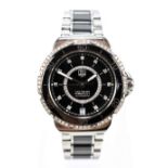 TAG HEUER; a lady's Formula 1 diamond set stainless steel and black ceramic wristwatch with date