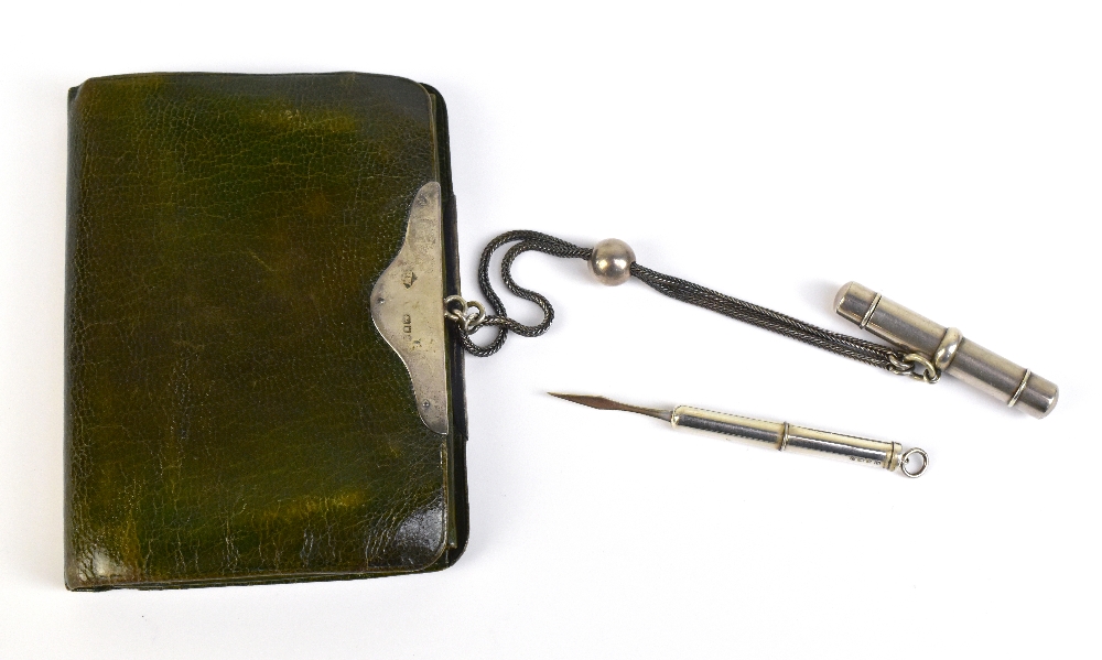 An Elizabeth II hallmarked silver toothpick, Birmingham 1990, and a leather purse with silver