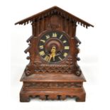 A late 19th/early 20th century Black Forest cuckoo clock for restoration, the circular dial set with