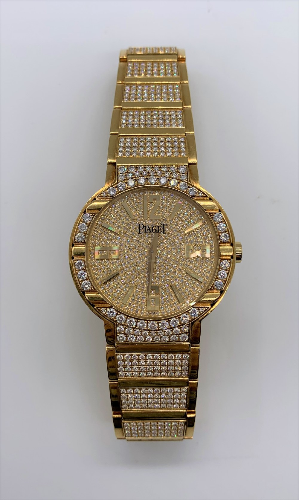 PIAGET; a gentleman's 18ct gold and diamond set wristwatch with brick link bracelet set with 600