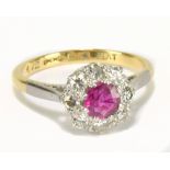 An 18ct yellow gold diamond and ruby cluster ring, the ruby weighing approx 0.25ct within a border