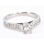 An 18ct white gold diamond solitaire ring, the principal stone weighing approx 0.50cts with