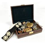 A mixed group of costume jewellery including brooches, two compacts, a bracelet, etc, housed in