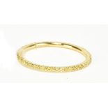 MESSIKA OF PARIS; an 18ct yellow gold and fancy yellow diamond full eternity ring, size N 1/2,
