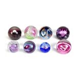 CAITHNESS; eight glass paperweights to include limited edition examples, comprising 'Spring