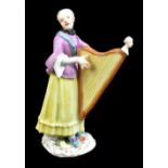 MEISSEN; a 19th century figure of a harpist, painted marks to base, height 13cm. Provenance: from