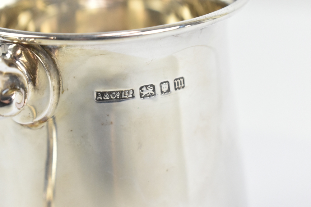 ASPREY; a George V hallmarked silver mug, with loop handles and spreading circular foot, London - Image 2 of 2