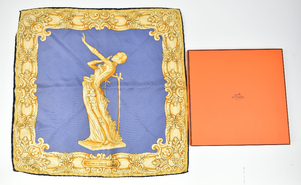 HERMÉS; a gold and blue silk handkerchief entitled 'La Femme en Flammes', with original Hermés Paris