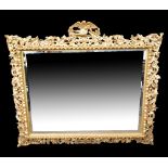 A good 19th century Florentine style mirror with elaborate floral pierced frame and central bevelled