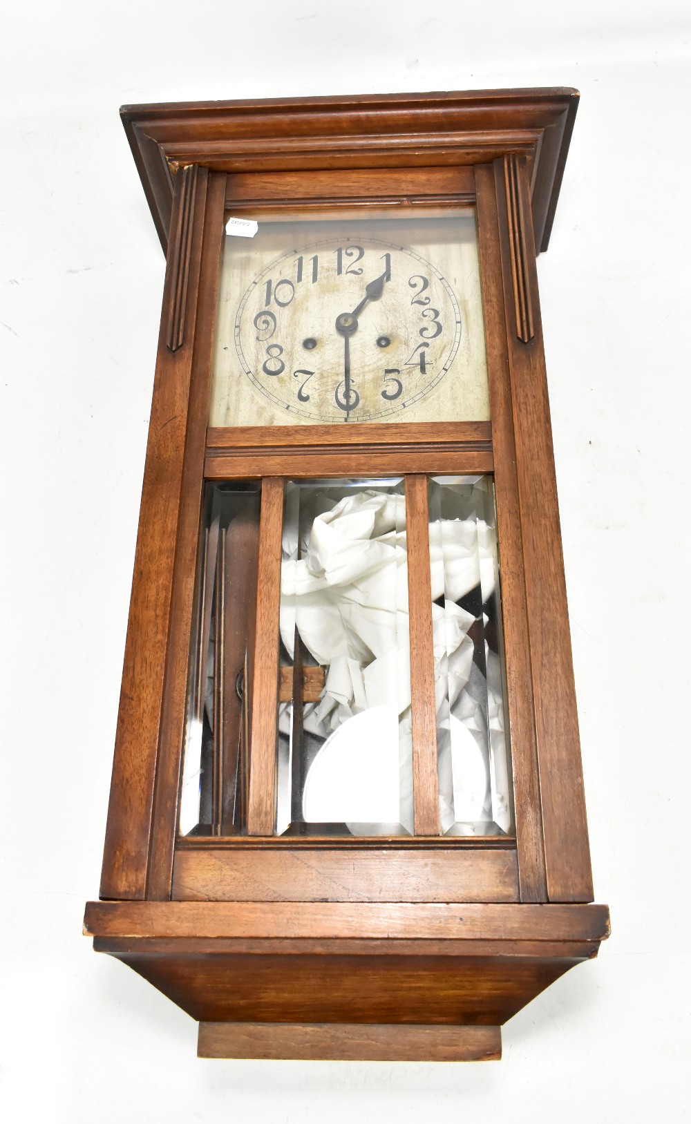An early 20th century mahogany cased drop dial wall clock, the circular silvered dial set with