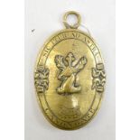 An unusual Edinburgh Canongate Alderman's oval brass badge, inscribed '1774', length 15.5cm.