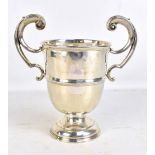 A George V hallmarked silver twin handled trophy with partially erased inscription 'Golf