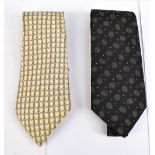 HERMÉS; a cream and silver link and hoop silk tie, and black and cream patterned silk tie.