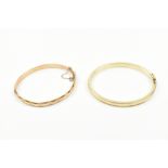 Two 9ct yellow gold and filled hinged snap bangles.