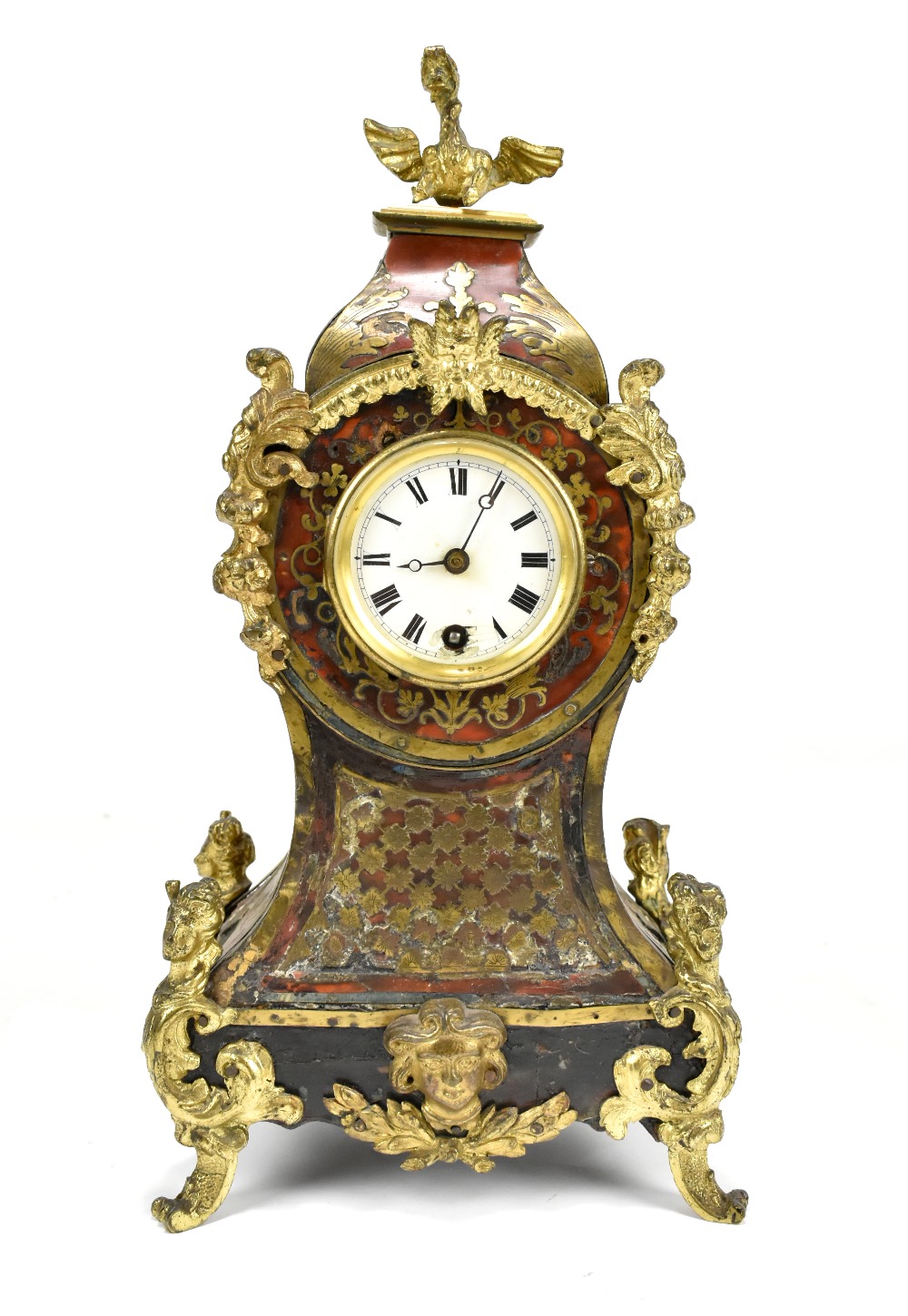 A 19th century boullework mantel clock, with mythical beast finial and inlaid brass scrolling