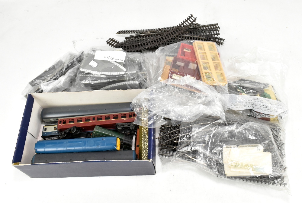 A group of playworn toys to include Tri-ang R357 diesel engine, track architecture and track.