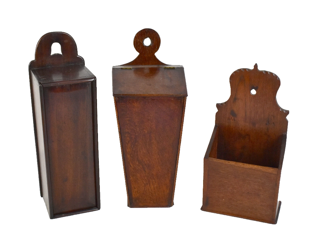 Two Georgian candle boxes, one oak, height 40cm, and a further later oak example (3).