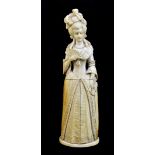A good early 19th century Dieppe ivory female figure, modelled as a courtesan holding a fan with