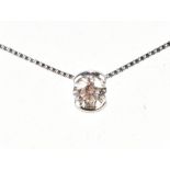 THEO FENNELL; an 18ct white gold and diamond necklace with round brilliant cut stone weighing approx